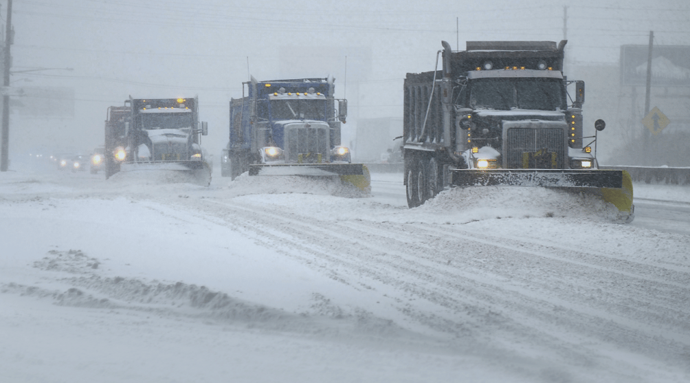 Snow Plows working in an echelon formation